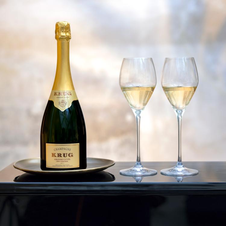 A bottle of Krug Grande Cuvée and two glasses