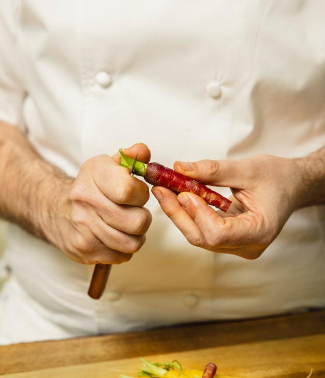 Krug Ambassade Chef Arnaud Faye preparing carrots for his recipe