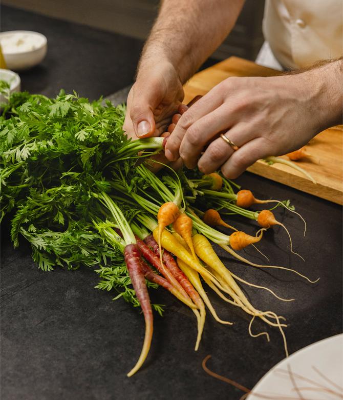 Chef Arnaud Faye prepares carrots for his food pairing recipe