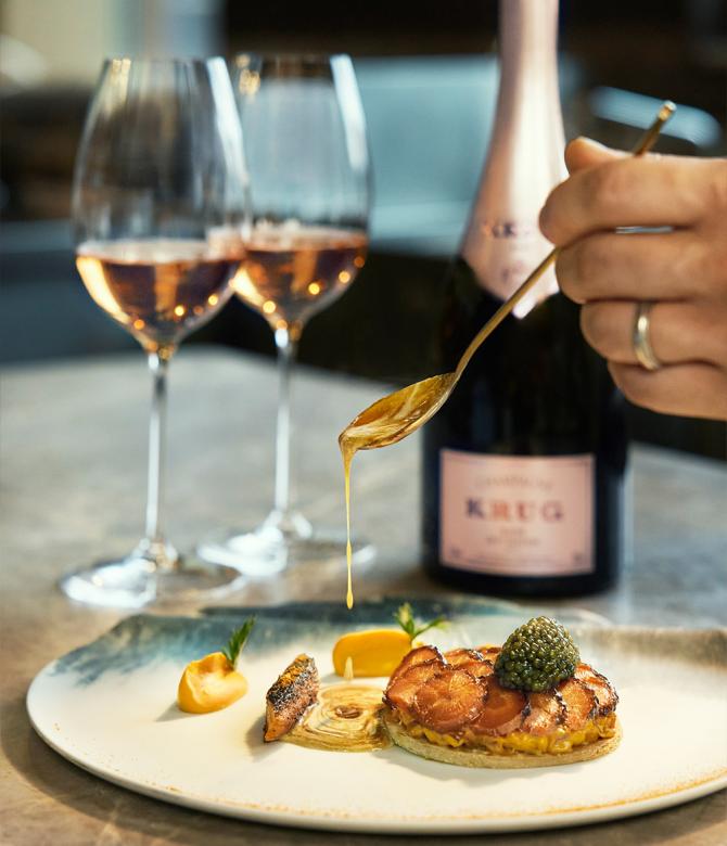 Chef Vicky Cheng's food pairing with a bottle of Krug champagne and two glasses