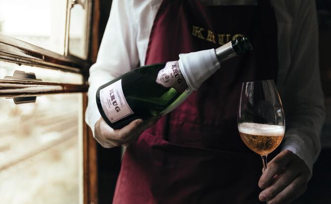 A sommelier pouring a glass of Krug Rosé