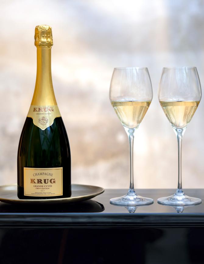 A bottle of Krug Grande Cuvée and two glasses
